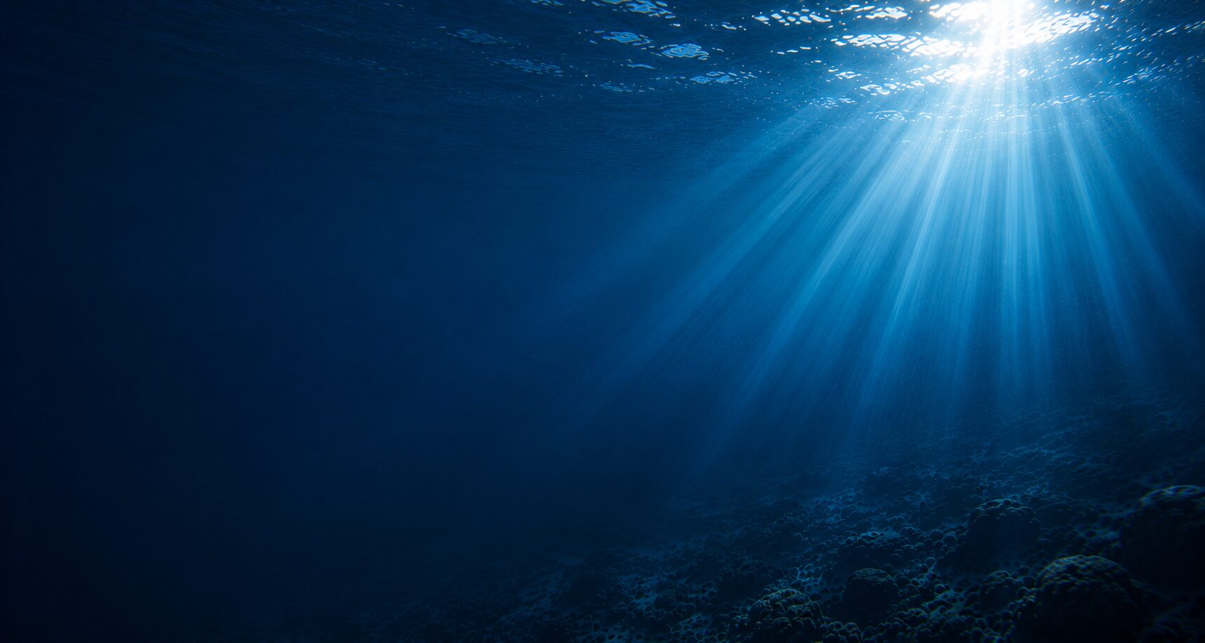 Sunlight streaming through deep ocean water